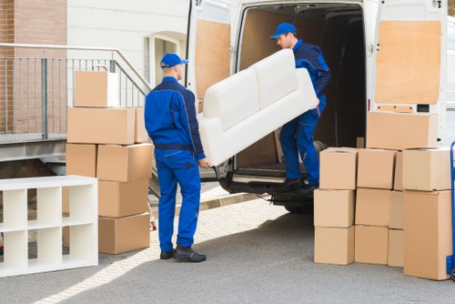 Removal team helping a resident move boxes in The Hyde