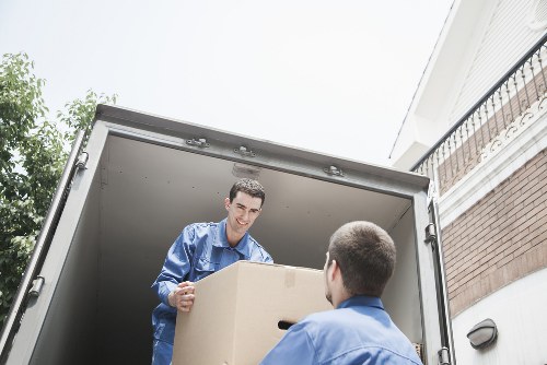 Professional movers navigating flat access in The Hyde