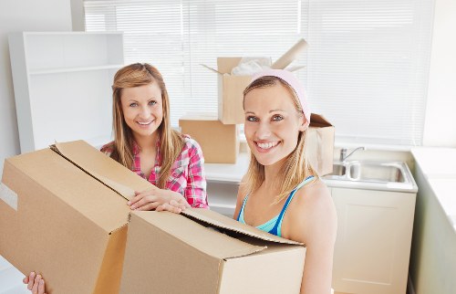 Commercial moving team handling office furniture and equipment in The Hyde