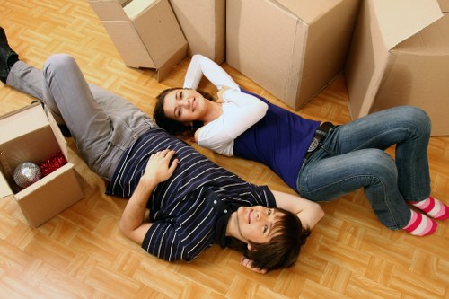 Unpacking boxes and organising rooms in a new home