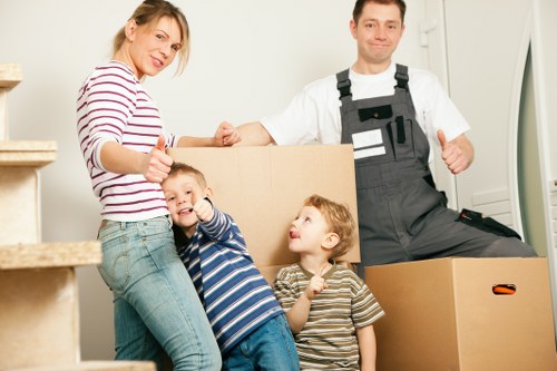 Loading household items into a removals van in The Hyde